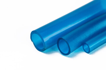 Tips of rubber hoses of different diameters, on a white background