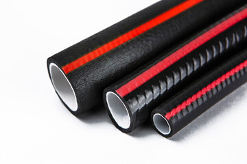 Tips of rubber hoses of different diameters, on a white background