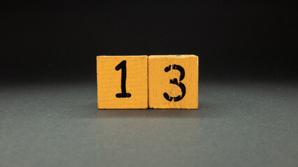 number thirteen in wooden cubes