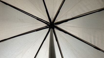 open gray umbrella focused from below