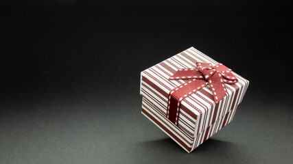 bowed surprise gift with red bow