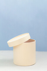 white pedestal against blue color background, empty space for text