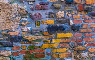 old weathered brick wall of a house, urban background close up