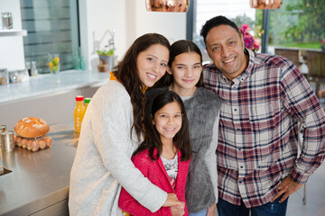 Portrait happy family in kitchen