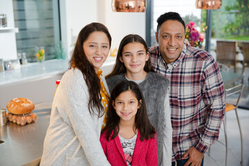 Portrait happy family in kitchen
