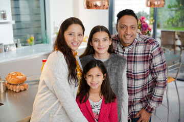 Portrait happy family in kitchen