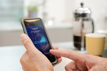 Man logging on to smart phone with face recognition