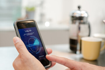 Man logging on to smart phone with face recognition