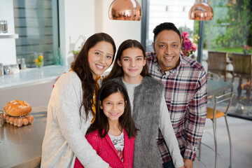 Portrait happy family in kitchen