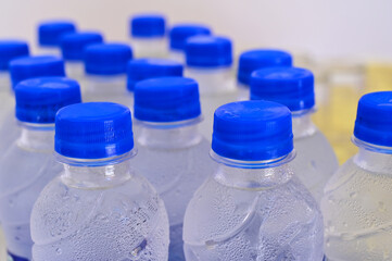 Closeup of bottles filled with clean cold mineral water