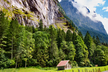 Natural landscape with small villages in the high mountains of Bernese Oberland, Switzerland.	