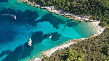 Fototapeta na wymiar Aerial drone photo of small marina and sandy beach in island of Antipaxos, Ionian, Greece