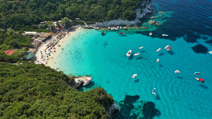 Fototapeta na wymiar Aerial drone photo of beautiful azure exotic turquoise beach of Voutoumi in island of Antipaxos a popular yacht and sailboat anchorage with crystal clear calm sea, Ionian, Greece