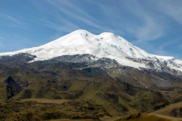 Panoramic view of the slope of Mount Elbrus in the Caucasus Mountains in Russia. Snow-capped peaks.