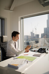 Businessman working at desk in modern office