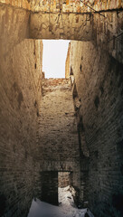 brick destroyed old structure with  overhead light, blurred image