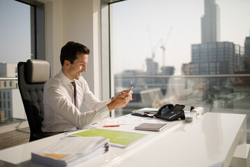 Businessman working at desk in modern office