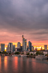 Fototapeta na wymiar View of Frankfurt at sunset. Backlit shot with a view of the skyline. High-rise buildings of banks and insurance companies in the financial district