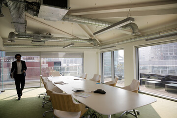 Business people leaving conference room after meeting