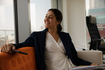 Portrait of businesswoman using smartphone in office