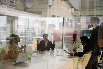 Businessman leading conference room meeting