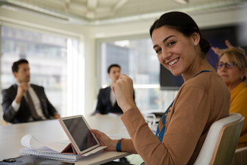 Portrait of businesswoman in conference room meeting