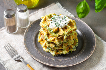 Homemade zucchini waffles in a plate on a culinary background closeup	