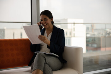 Portrait of businesswoman using smartphone in office