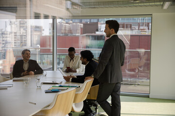 Businessman leading conference room meeting