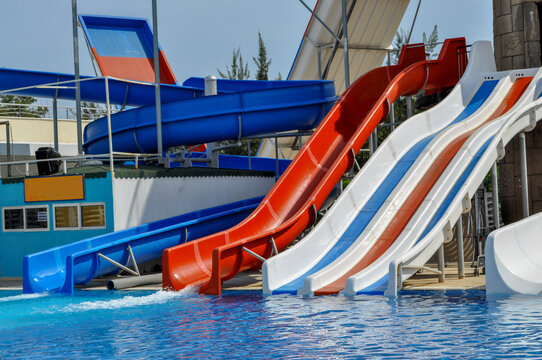 happy child have fun on water slike on outdoor swimming pool
