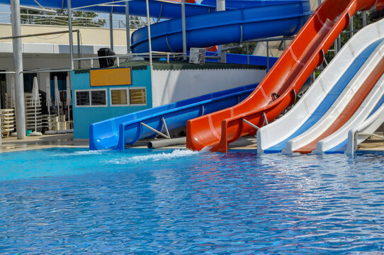 happy child have fun on water slike on outdoor swimming pool