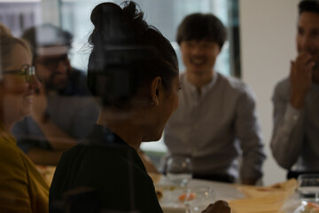 Business people eating sushi lunch in conference room
