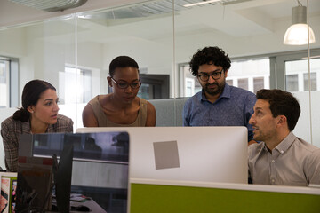 Business people brainstorming in open plan office