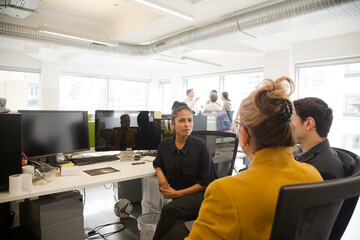 Naklejka premium Business people talking in open plan office