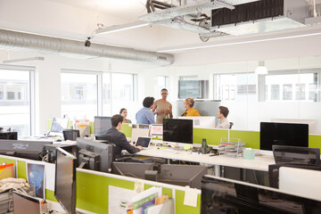 Business people meeting in open plan office