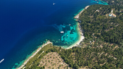 Fototapeta premium Aerial drone photo of luxury yachts and sail boats anchored in tropical exotic island emerald bay with crystal clear calm sea