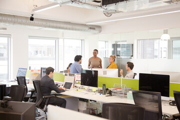 Business people meeting in open plan office