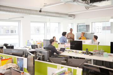 Business people meeting in open plan office