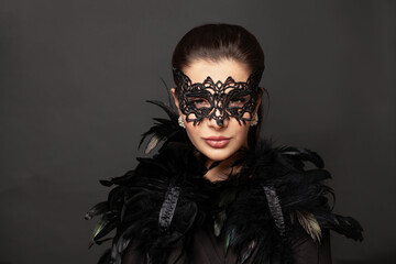 Portrait of perfect woman in carnival mask. Holiday fashion model portrait. Beauty hairstyle and...