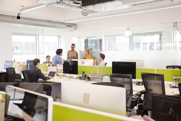 Business people meeting in open plan office