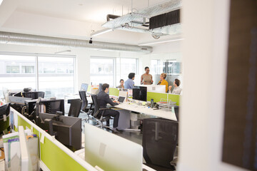 Business people meeting in open plan office