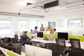Business people meeting in open plan office