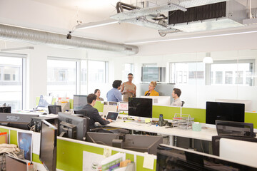 Business people meeting in open plan office