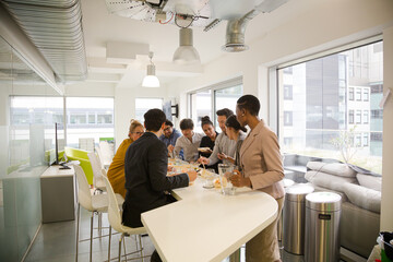 Happy business people enjoying sushi lunch