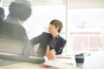 Businessmen talking in conference room
