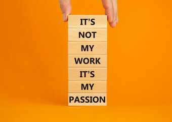 My work or passion symbol. Businessman hand. Wooden blocks with words 'It is not my work, it is my passion'. Beautiful orange background, copy space. Business and my work or passion concept.