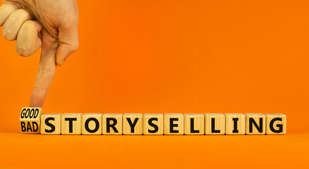 Good or bad storyselling symbol. Businessman turns a wooden cube, changes words 'bad storyselling' to 'good storyselling'. Beautiful orange background, copy space. Business and storytelling concept.