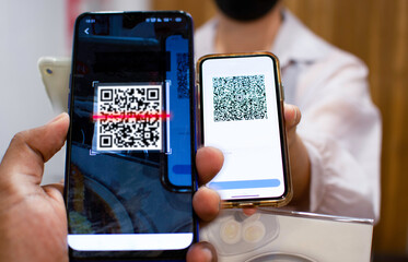 Smartphone screen, scan QR code to pay for food at the counter Concept of technology in payment