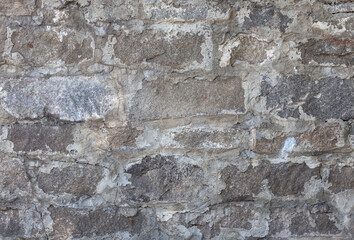 Wall texture from old stone, close-up. Stone gray background