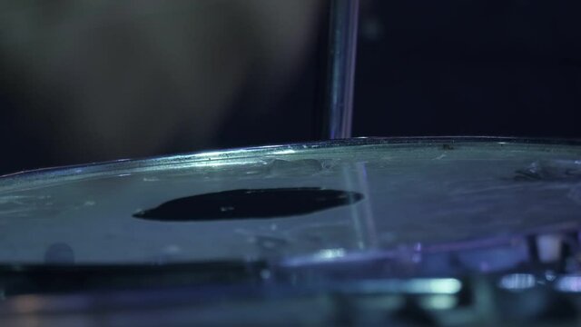 Musician is playing drums on stage, drummer.